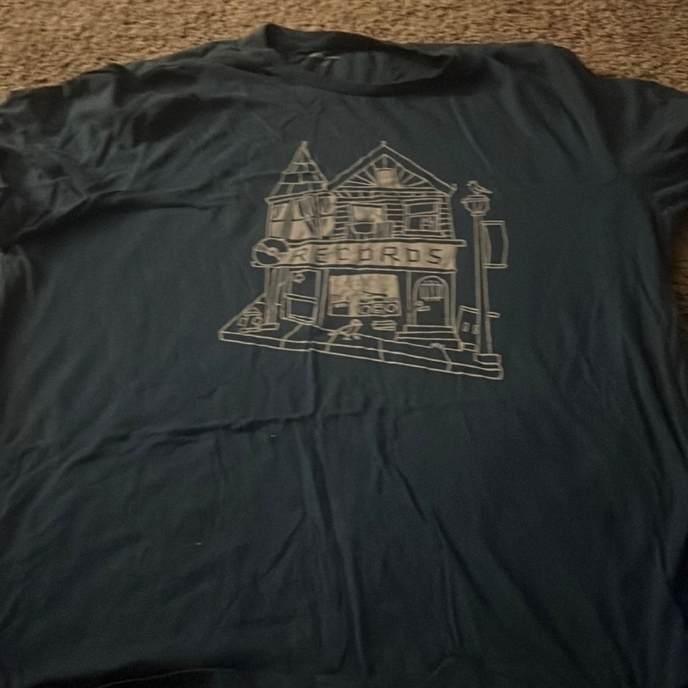 A green graphic shirt